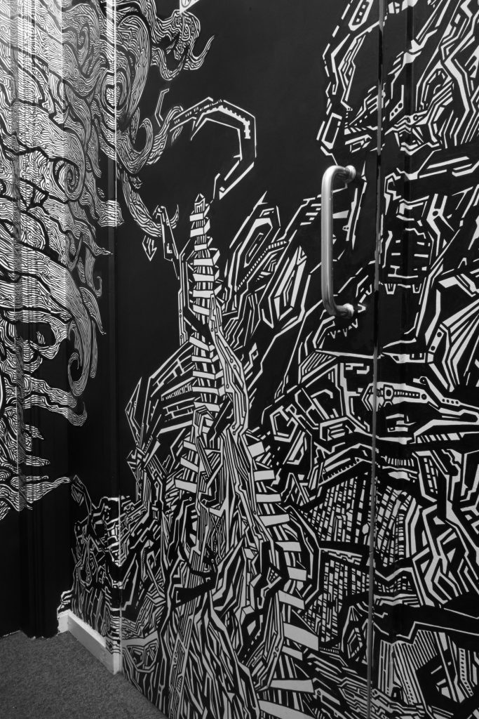 Block T illustrated, detailed cityscape and girl’s hair line drawing with permanent markers installation graffiti wallart piece in Smithfield by Dublin based illustrator John Rooney..