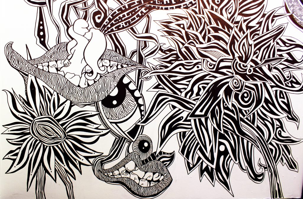 Illustrated, detailed black and white abstract line drawing of eyes, lips, flowers with permanent markers installation graffiti wallart piece in Ballina, Mayo, Ireland by berlin-based irish illustrator John Rooney.